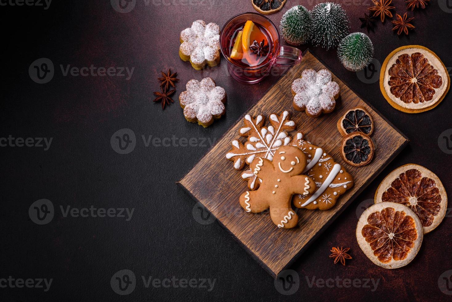 Hot mulled wine with a slice of orange, with cinnamon, cloves and other spices photo