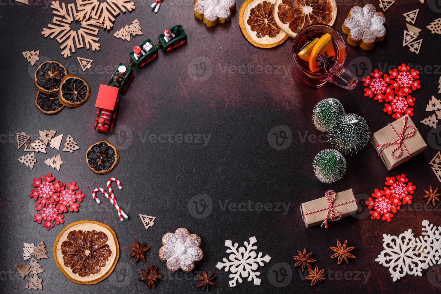 Hot mulled wine with a slice of orange, with cinnamon, cloves and other spices photo