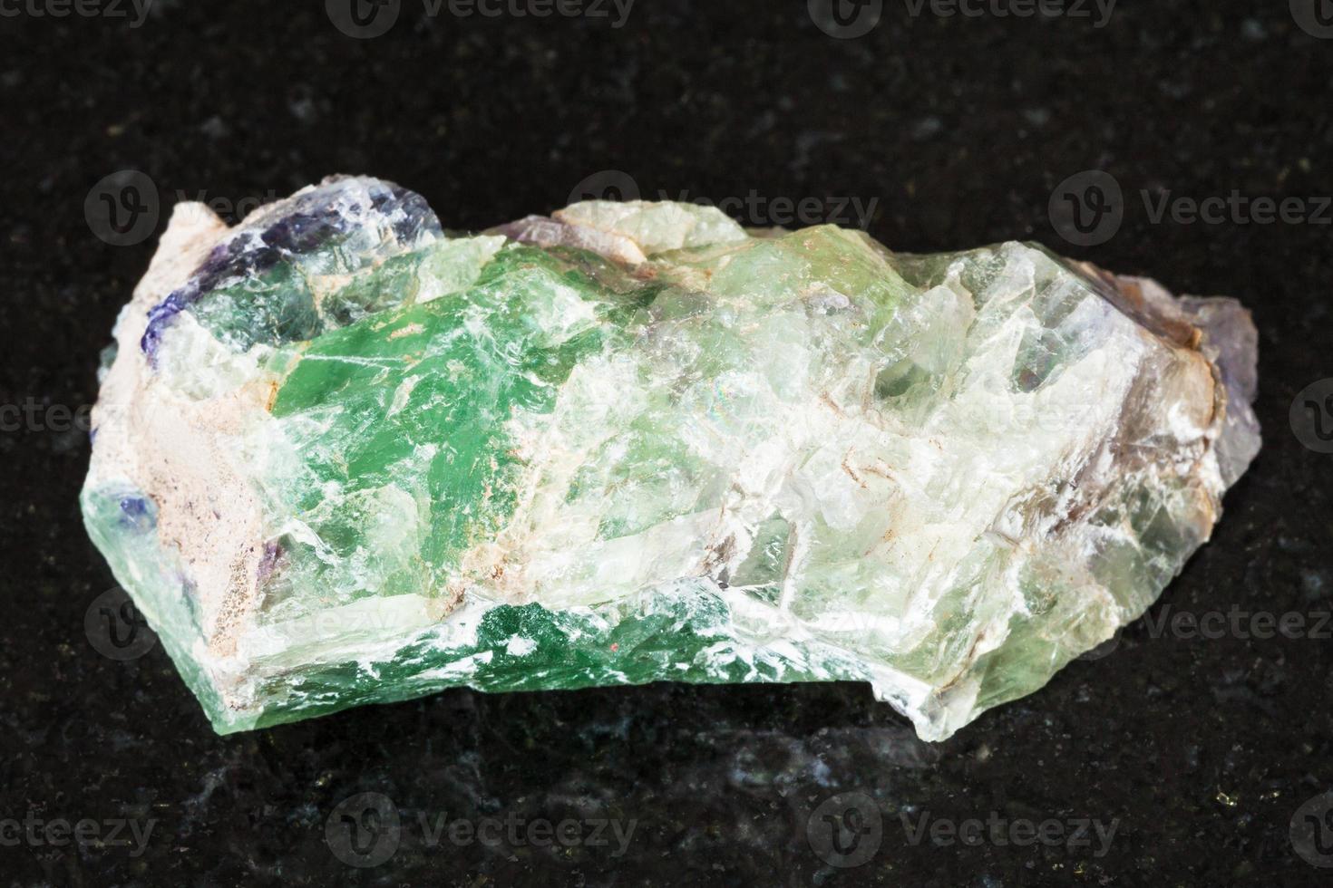rough green Beryl crystals on black 13037596 Stock Photo at Vecteezy