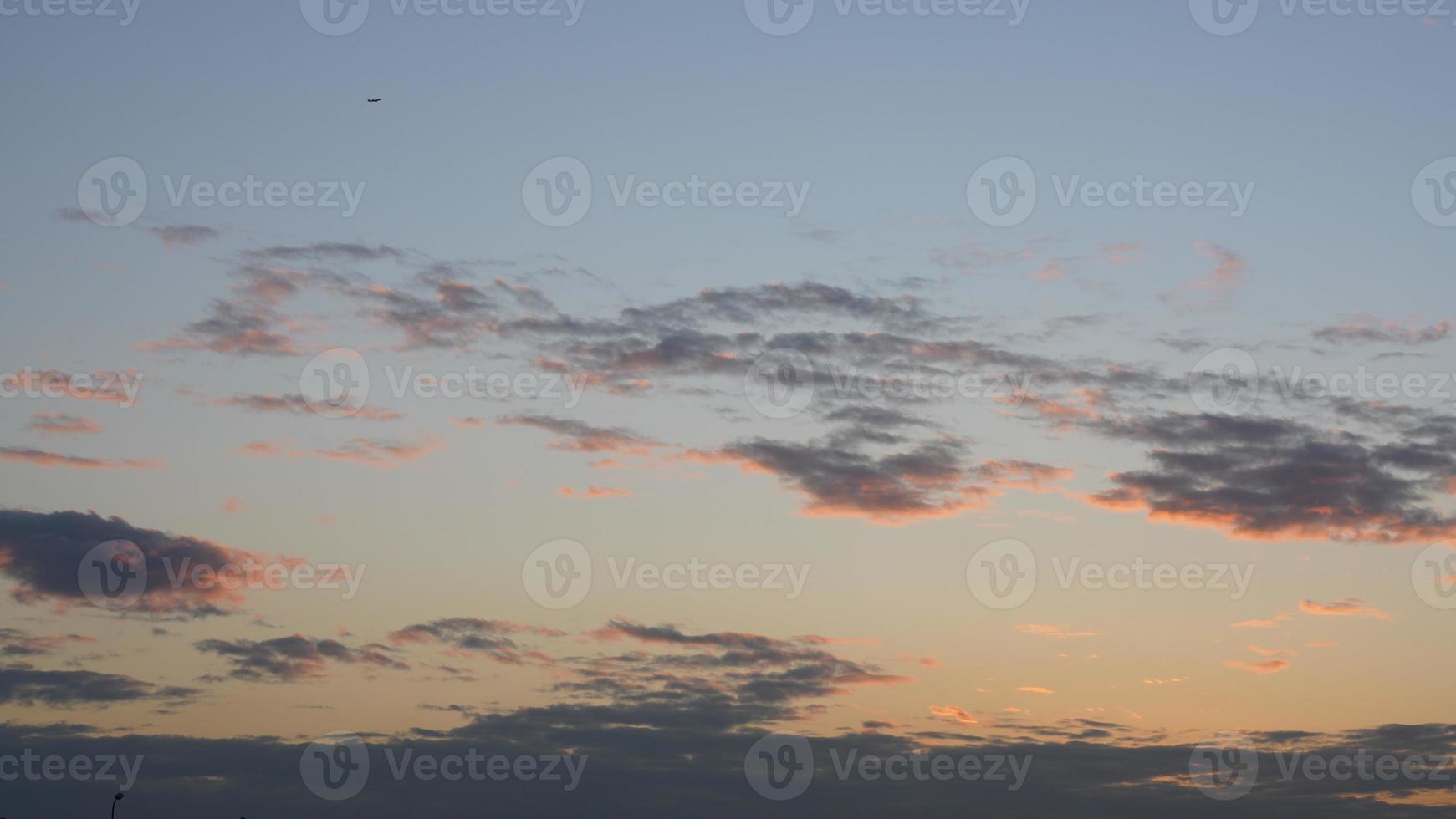The beautiful sunset view with the colorful clouds and sky in the city photo