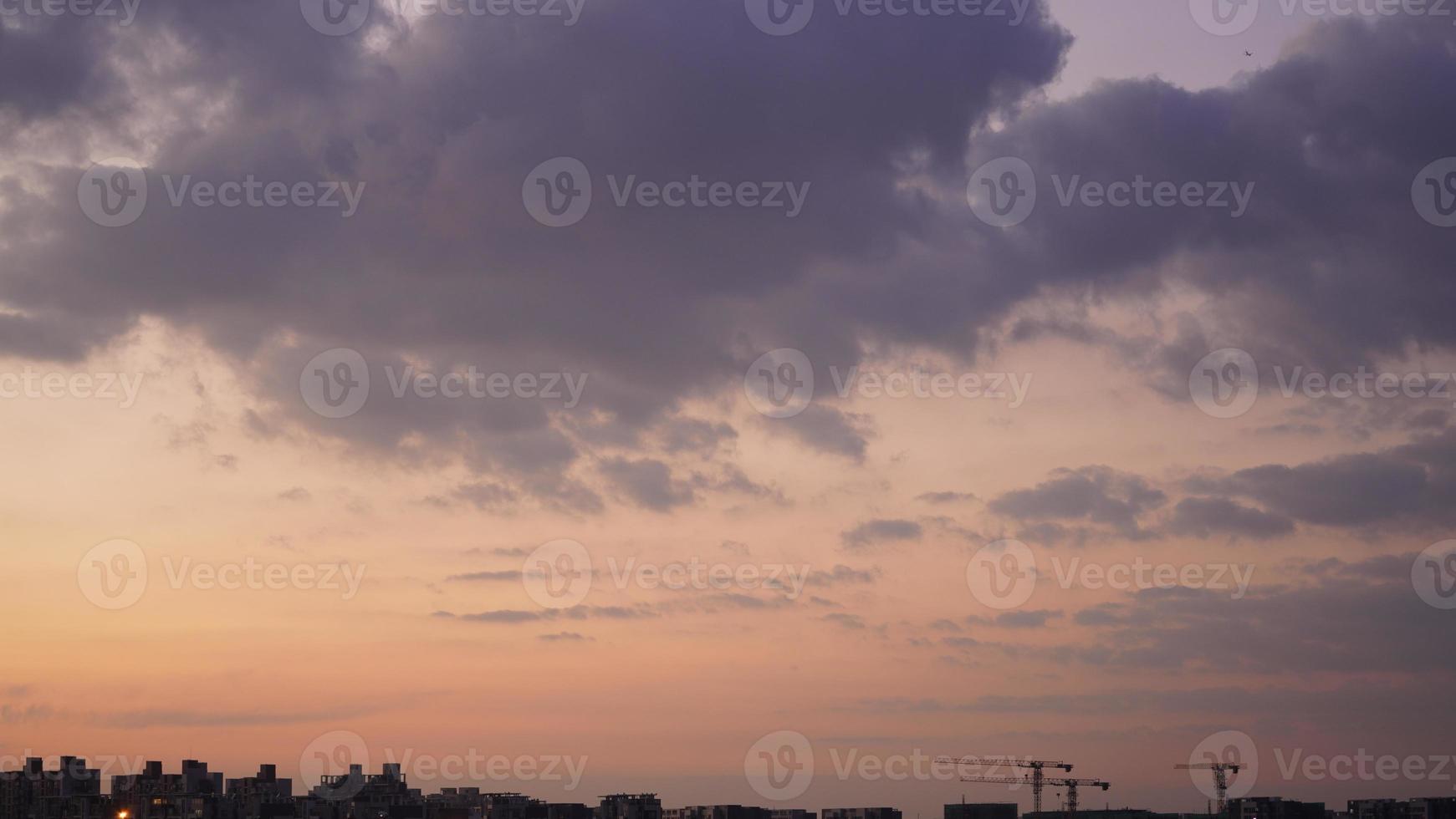 The beautiful sunset view with the colorful clouds and sky in the city photo