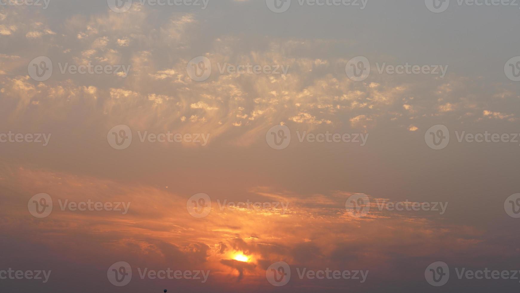 The beautiful sunset view with the colorful clouds and sky in the city photo