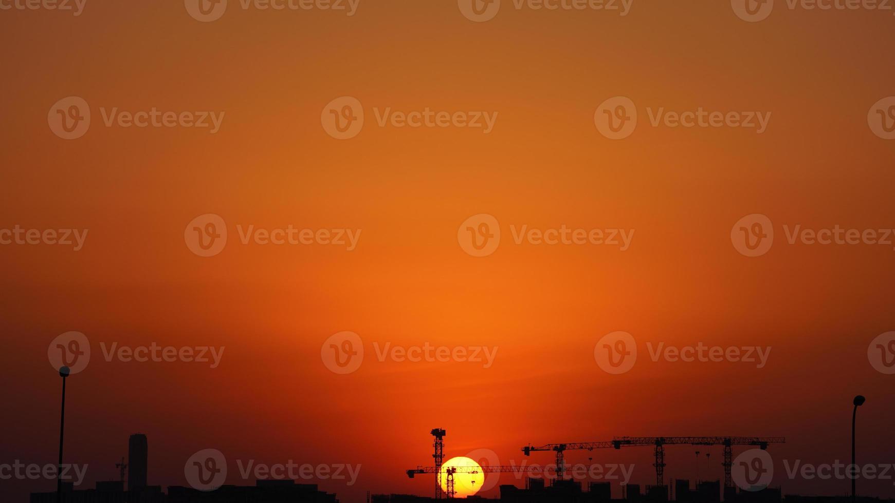 The beautiful sunset view with the colorful clouds and sky in the city photo