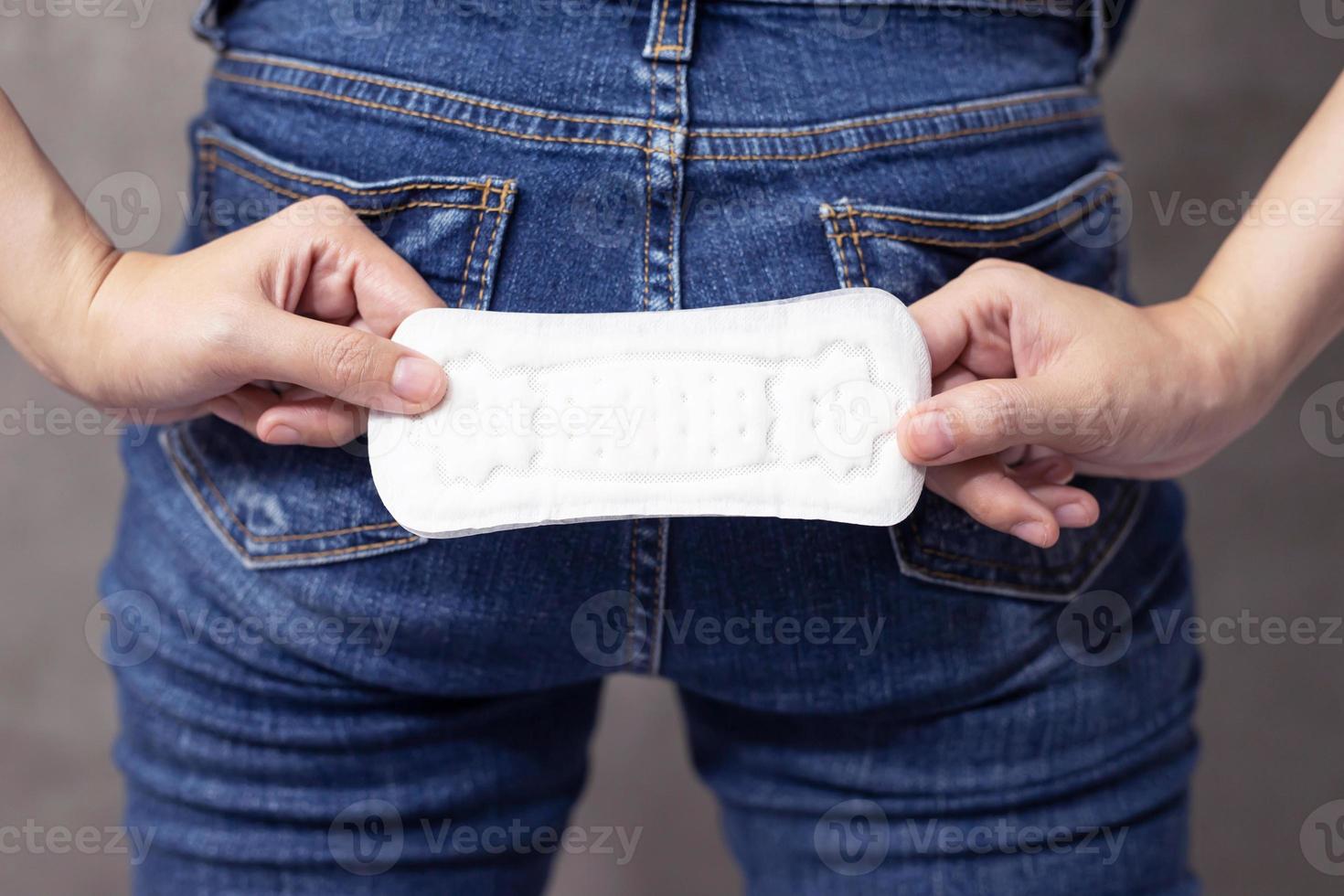 woman holding a sanitary napkin photo