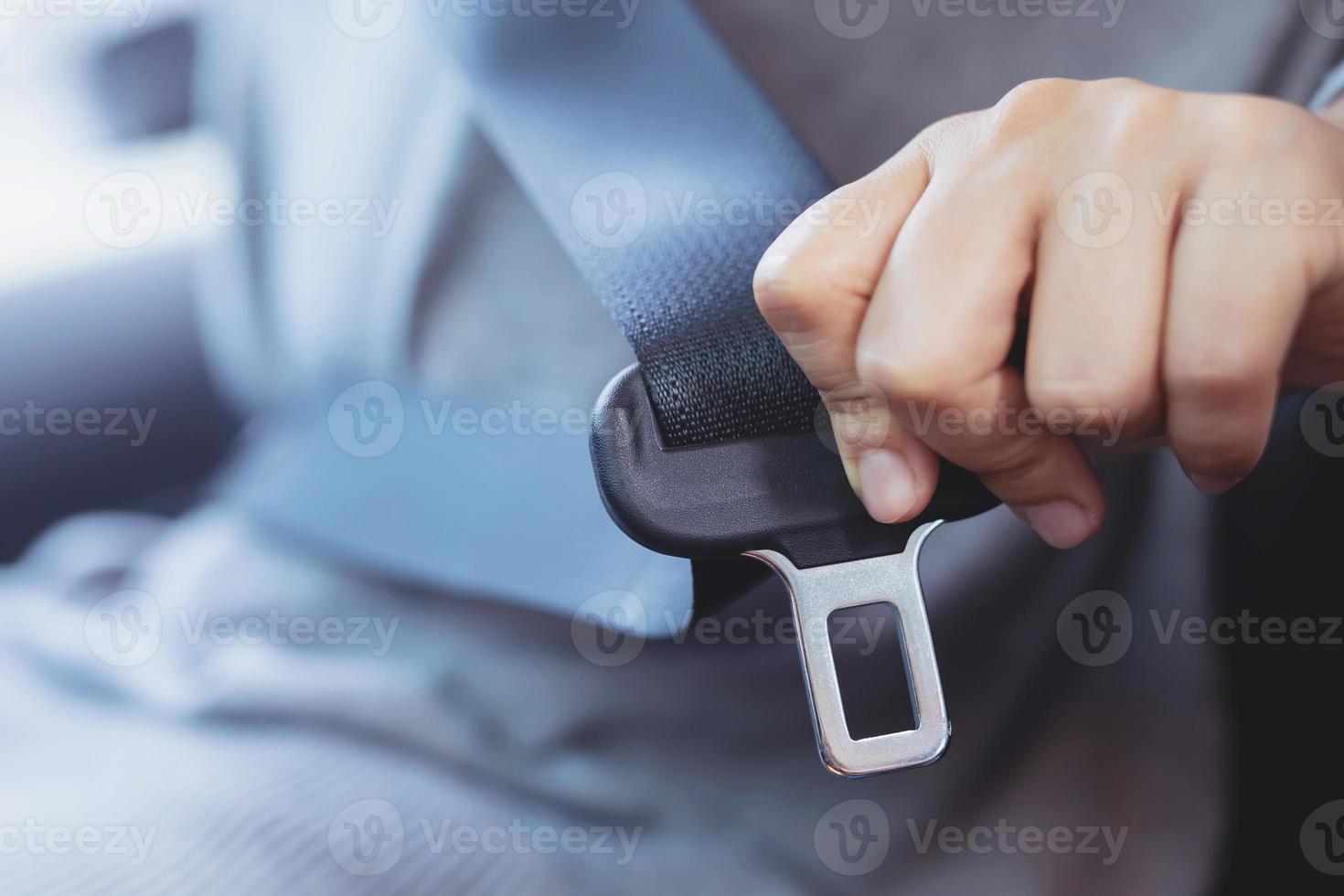 The driver wearing a seat belt for safety photo