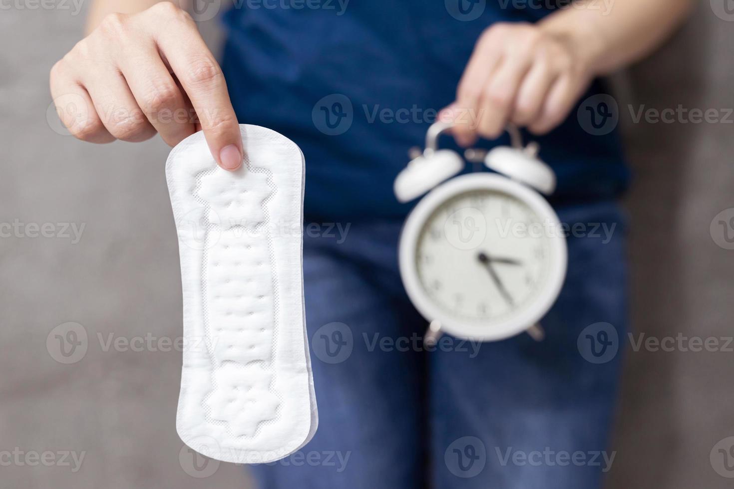 woman holding a sanitary napkin photo