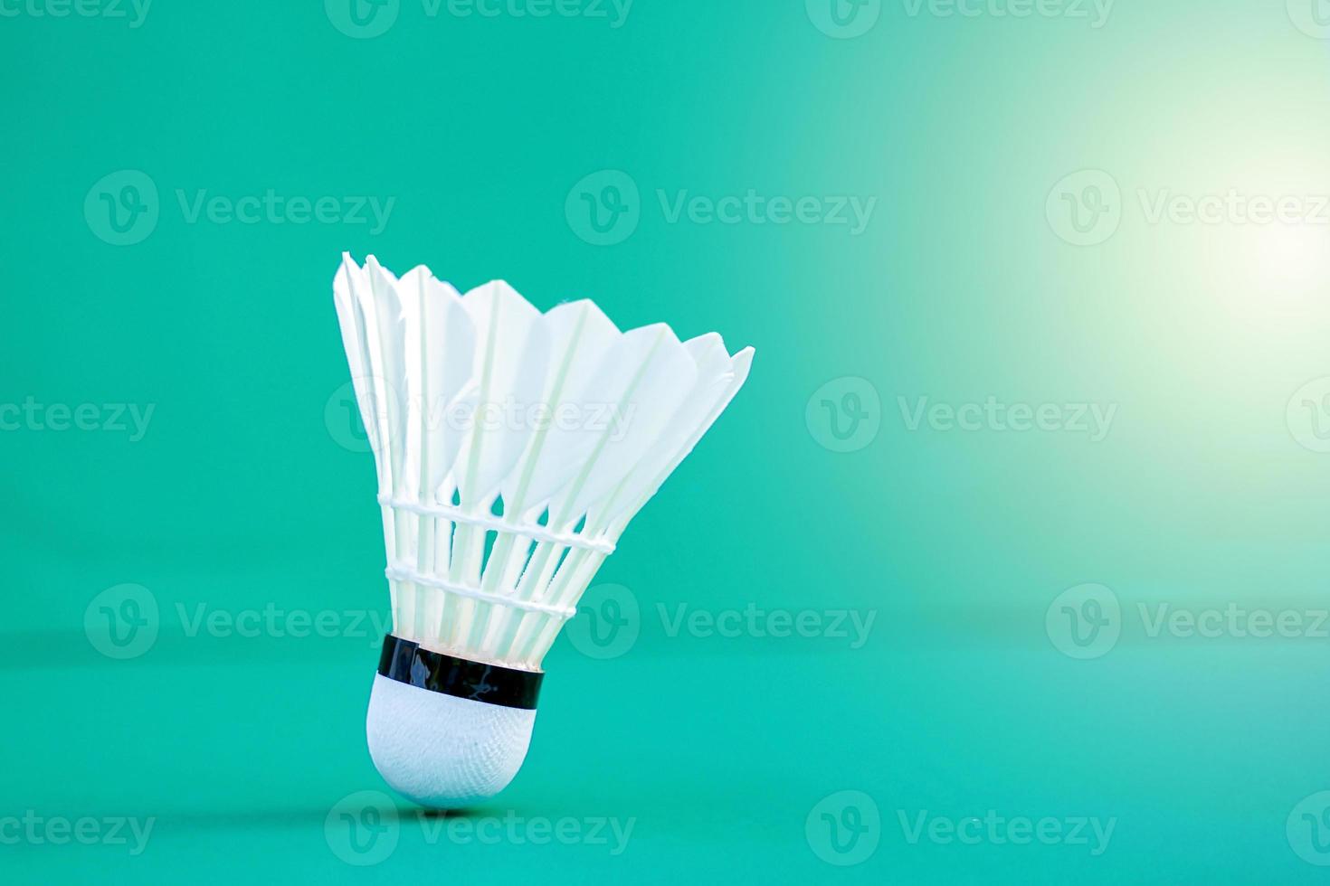 white shuttlecock on green background. soft and selective focus. photo