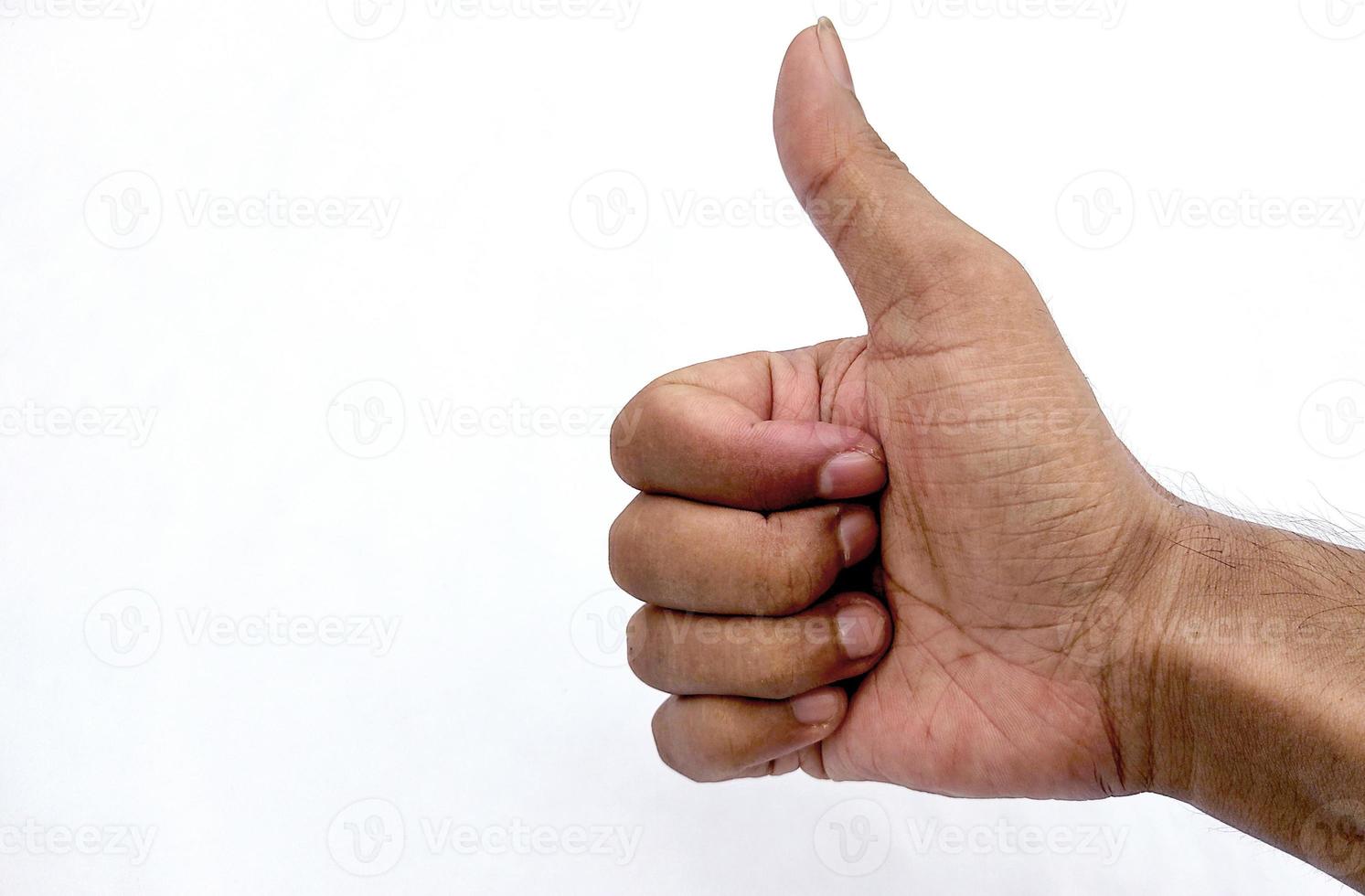 Closeup of male hand showing thumbs up sign against white background photo