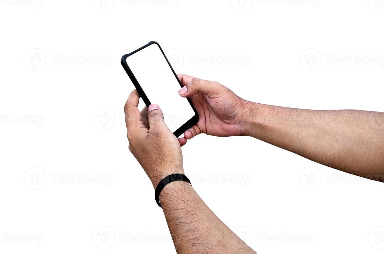 Man holding smartphone with blank screen on white background, closeup of hand. Space for text photo