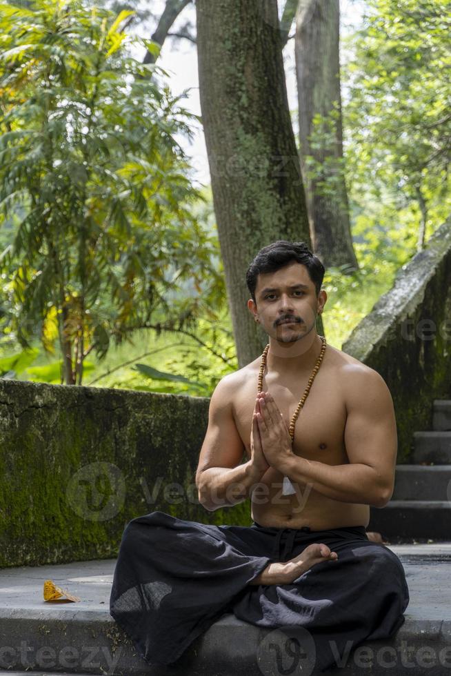 The sound Om written in Sanskrit in the Hindu and Vedic traditions sacred sound, the original mantra. yoga practice meditation photo
