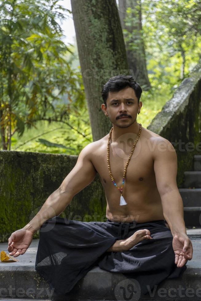 The sound Om written in Sanskrit in the Hindu and Vedic traditions sacred sound, the original mantra. yoga practice meditation photo