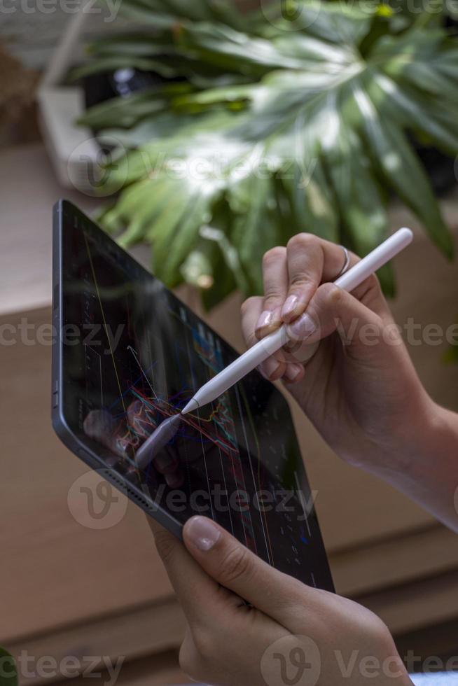 woman trading crypto currencies online and stocks photo