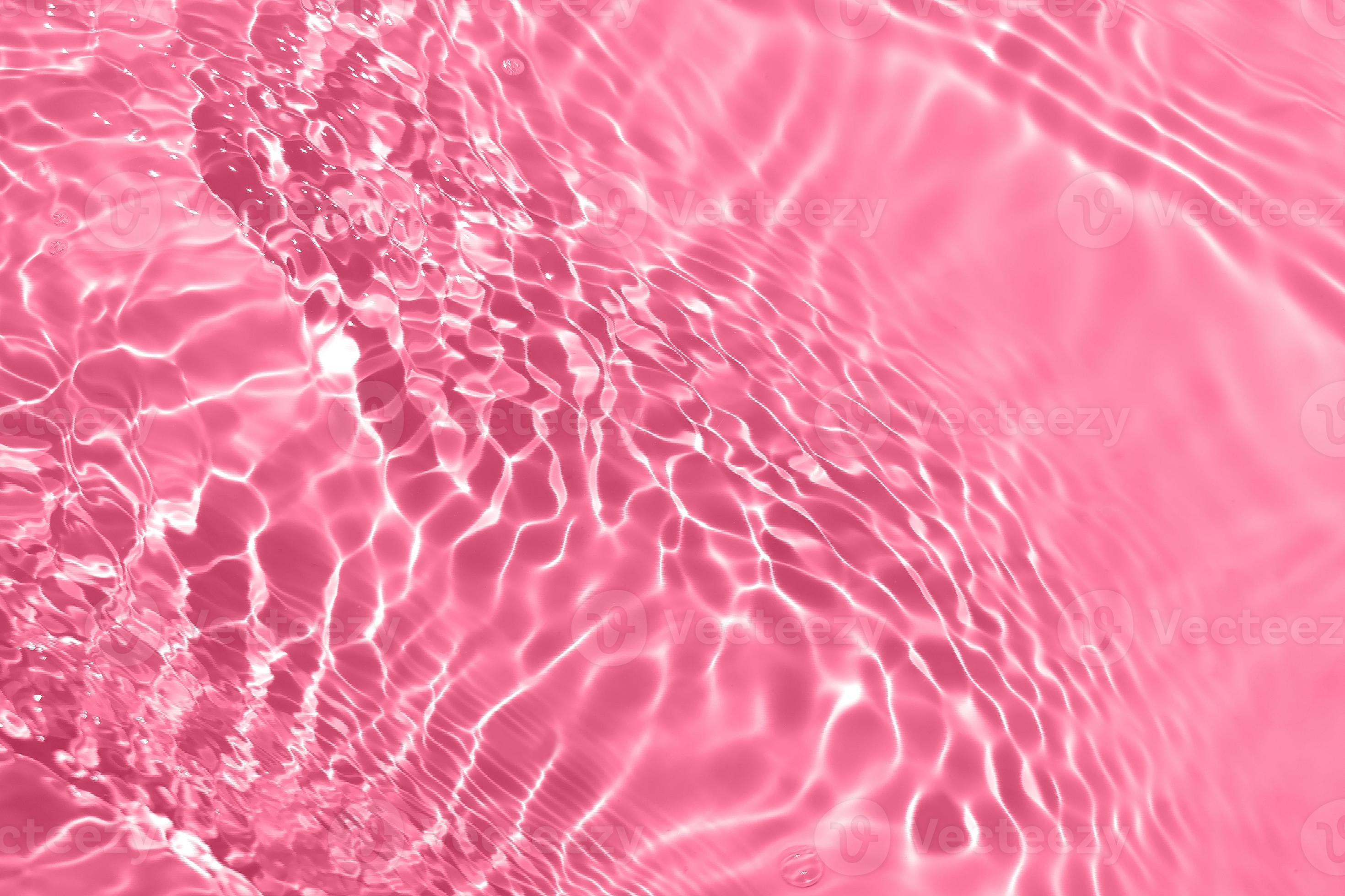 Defocus blurred transparent pink colored clear calm water surface texture  with splash, bubble. Shining pink water ripple background. Surface of water  in swimming pool. Pink bubble water shining. 13040673 Stock Photo at