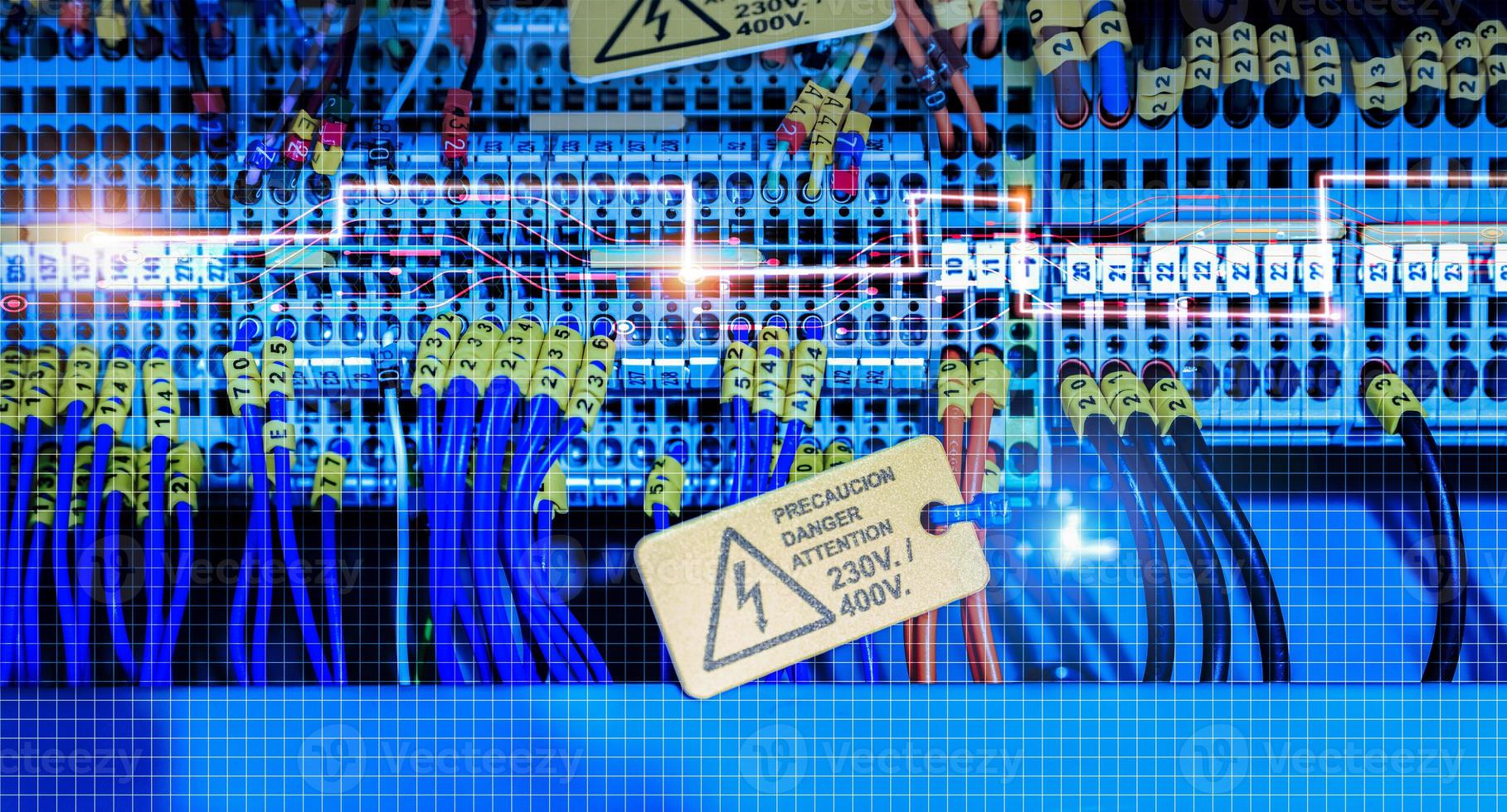 Electric wiring diagram of machinery in industrial factory. Terminal diagram with tag and warning label. High voltage electric wire. Automation machinery control panel. Electrical control cabinet. photo