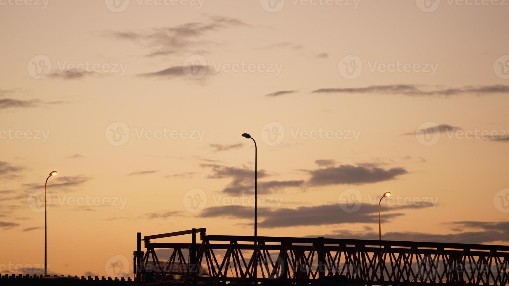 The beautiful sunset view with the colorful clouds and sky in the city photo