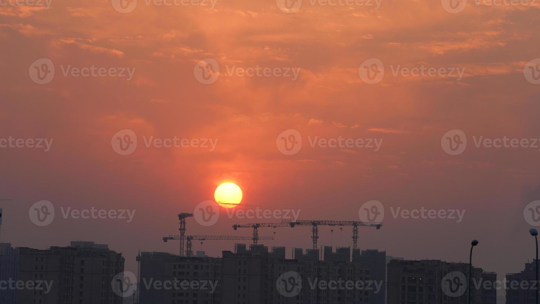 The beautiful sunset view with the colorful clouds and sky in the city photo