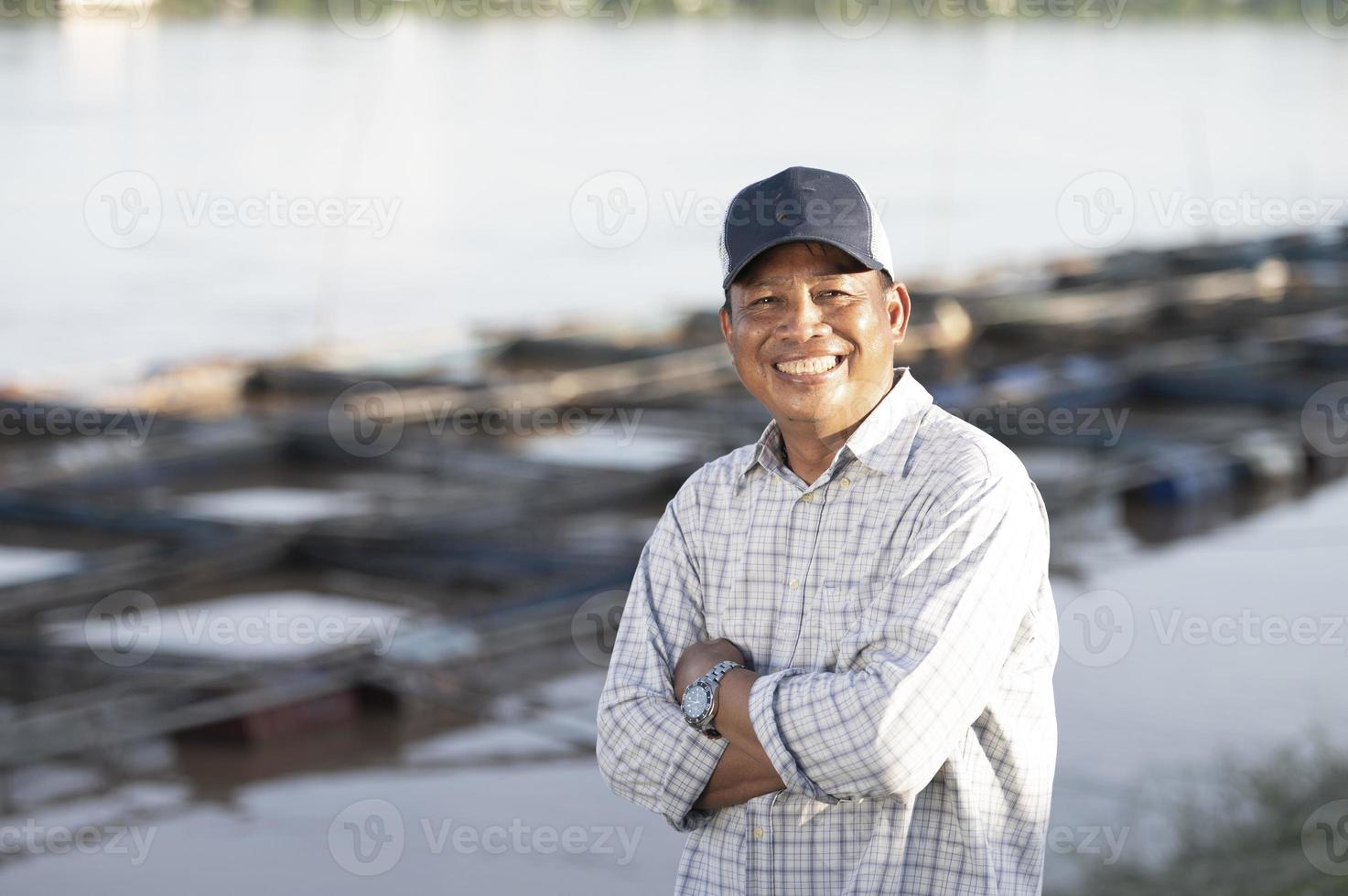 Fish farmers in tilapia farm catch large live tilapia for export to fish market. Fresh tilapia. photo