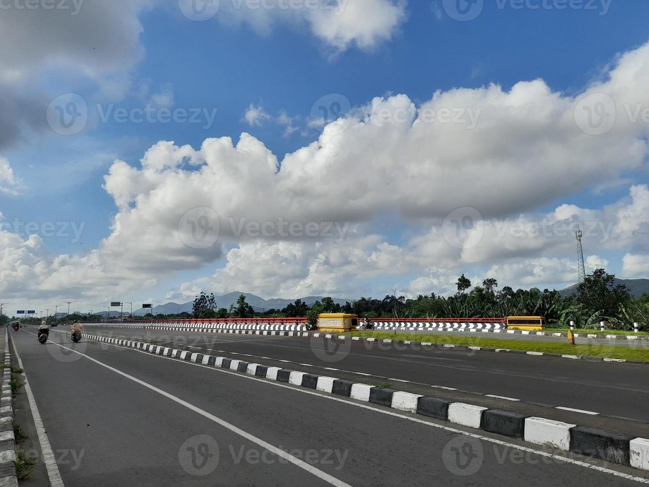 highway with blue sky background with few clouds photo