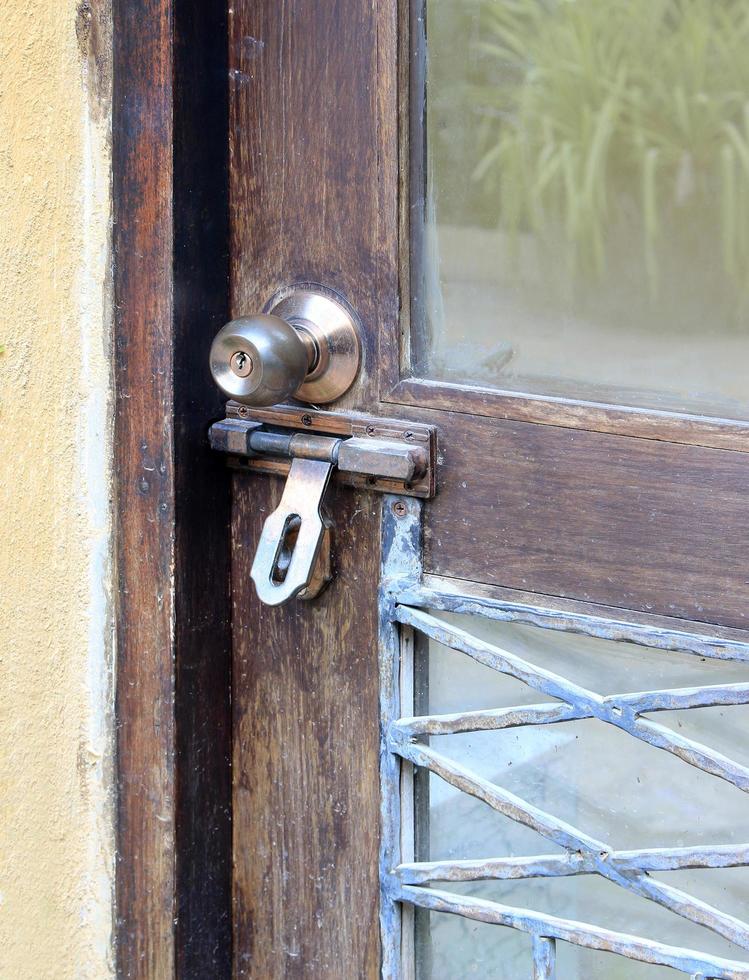 Closed old vintage wood door with door lock and knob 13041788 Stock