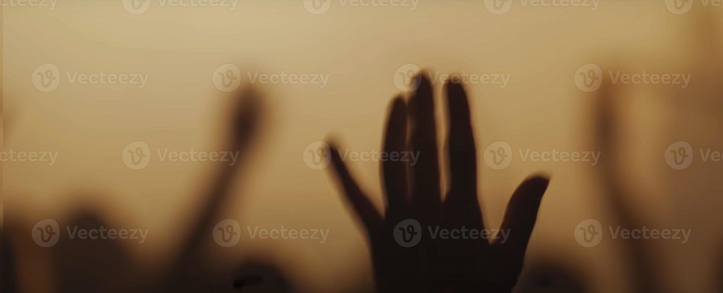 Blurry background picture of hand reaching out for God's help, good for your multimedia content background photo