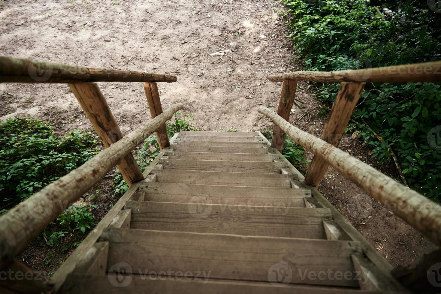 Wooden stairs for descent down and rise up. Old wooden steps photo
