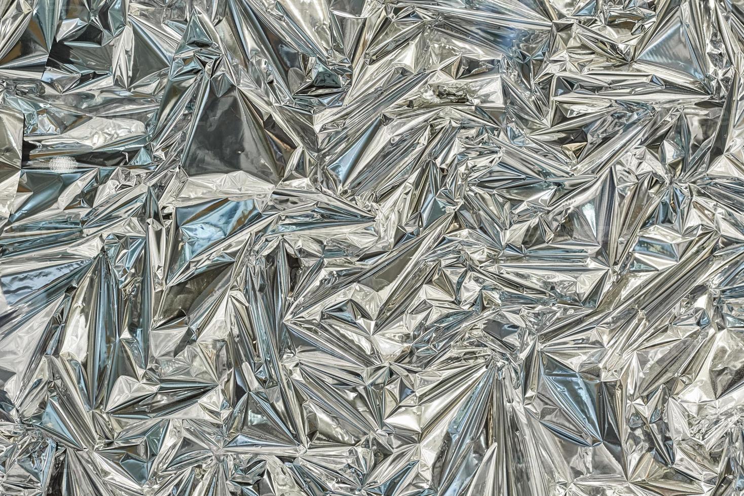 Silver poligonal abctract background. a foil texture background photo