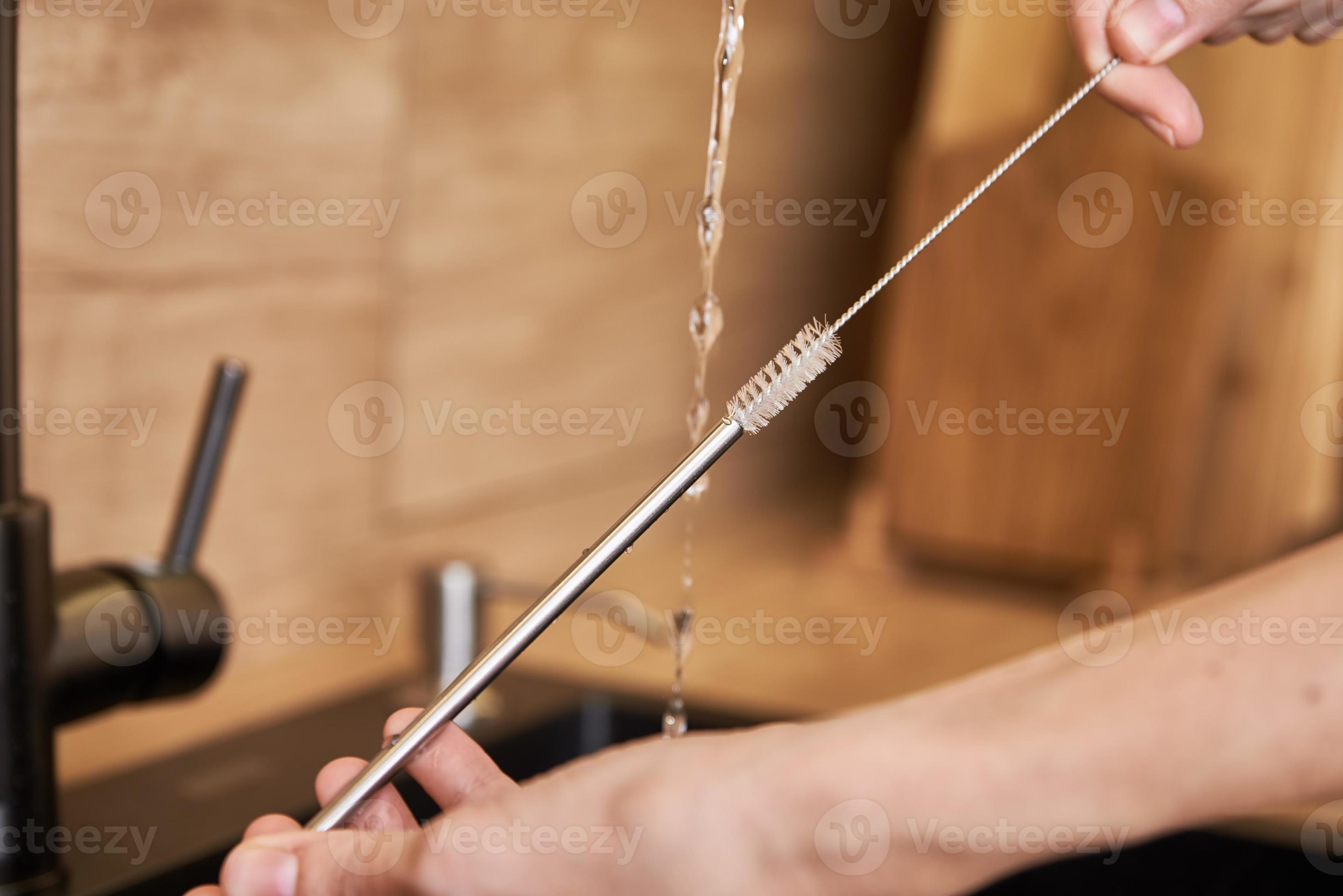 Woman clean metal straw with organic brush. Zero waste concept 13052774
