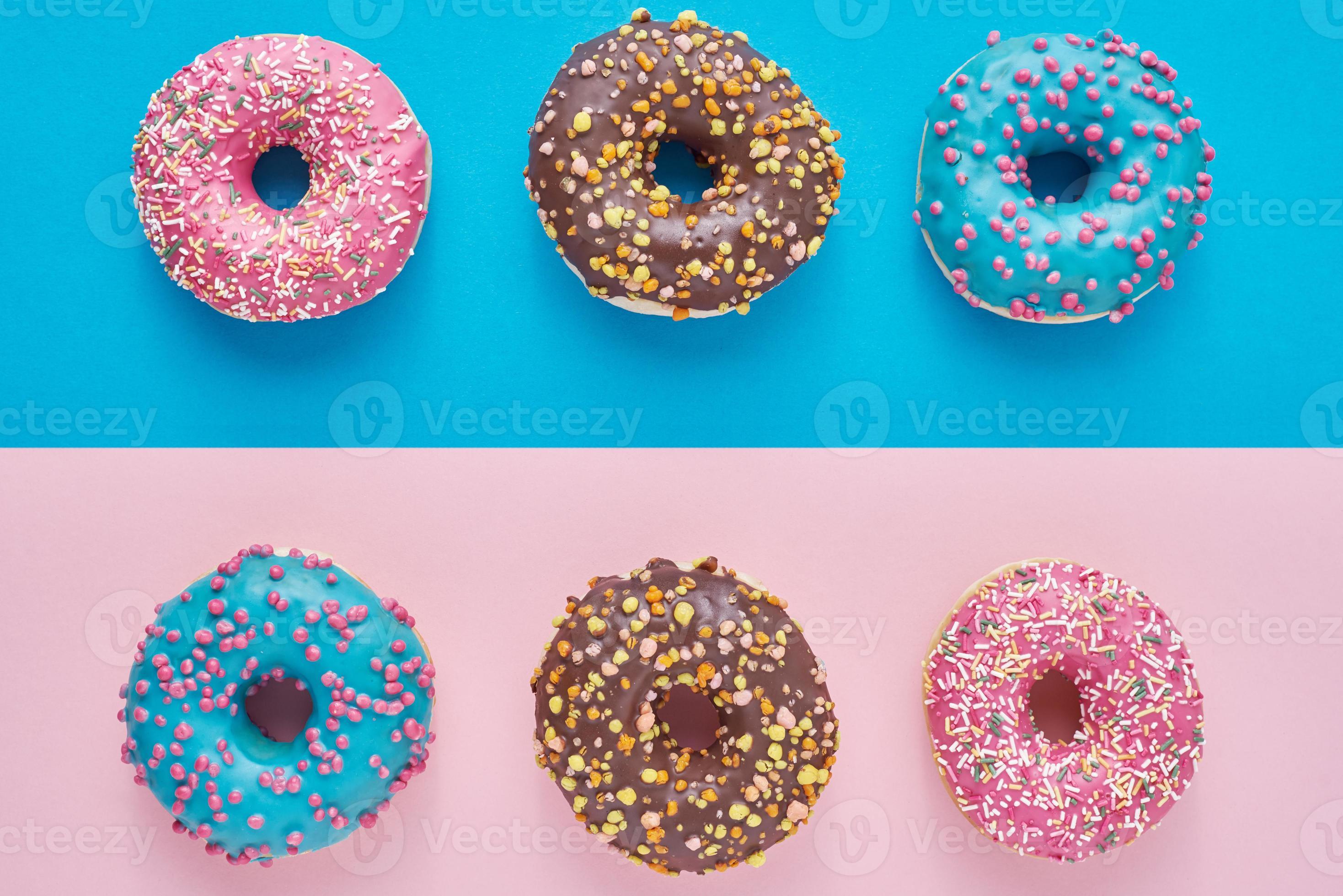 Donuts on a pastel pink and blue background. Minimalism creative food