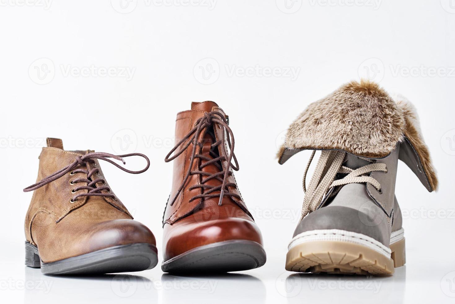 Three different leather womens boots on the white background isolated photo