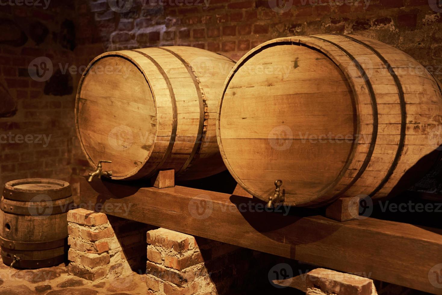 Two wine barrels in old wine cellar photo