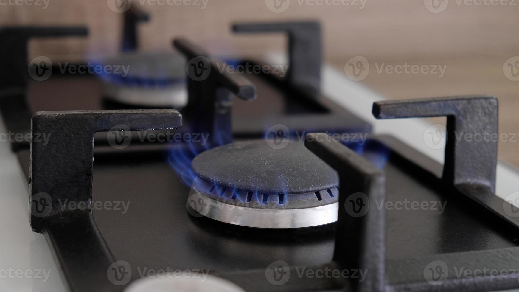 Closeup blue flames of fire on a gas burner in the kitchen for cooking