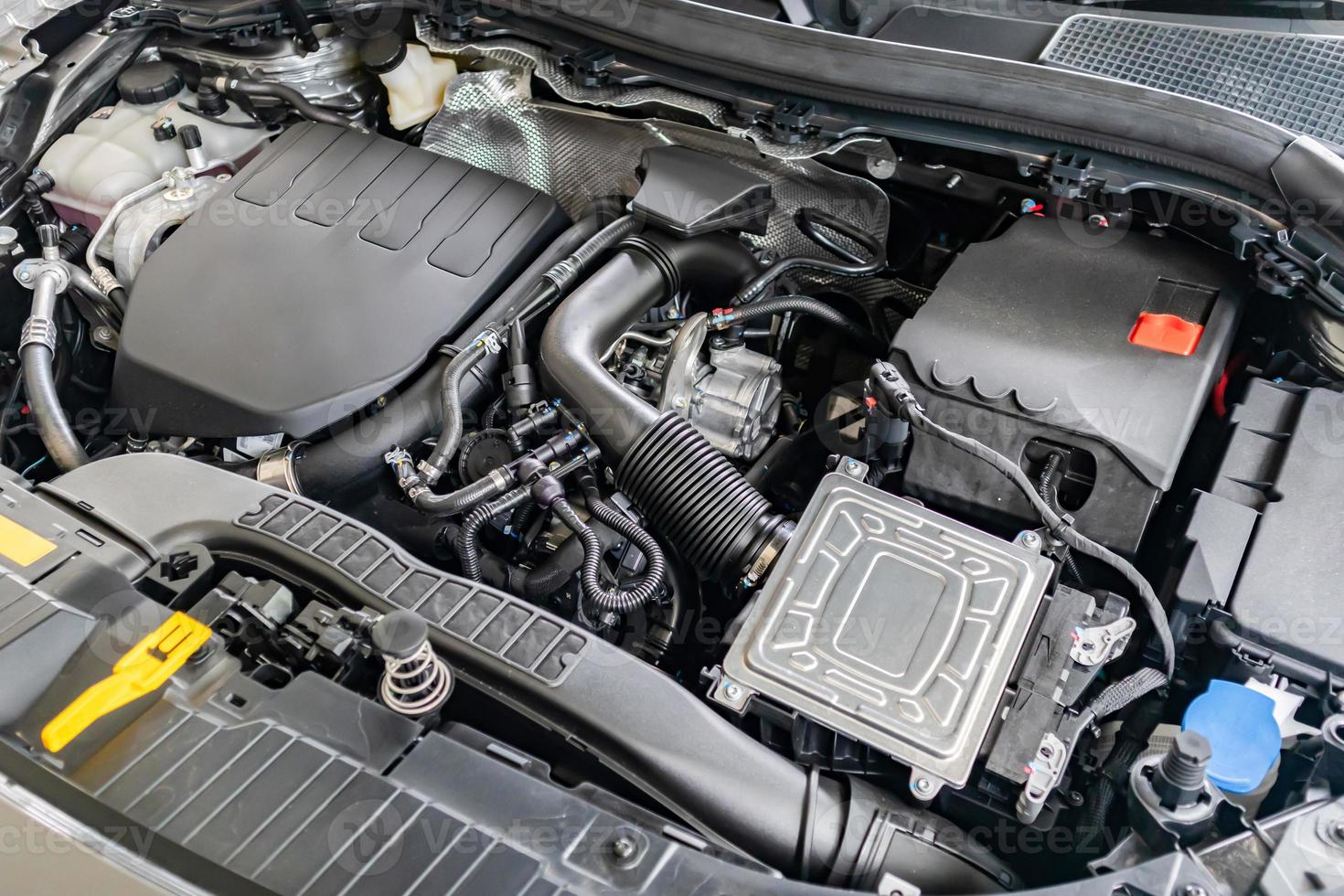 modern car engine under hood close up detail photo