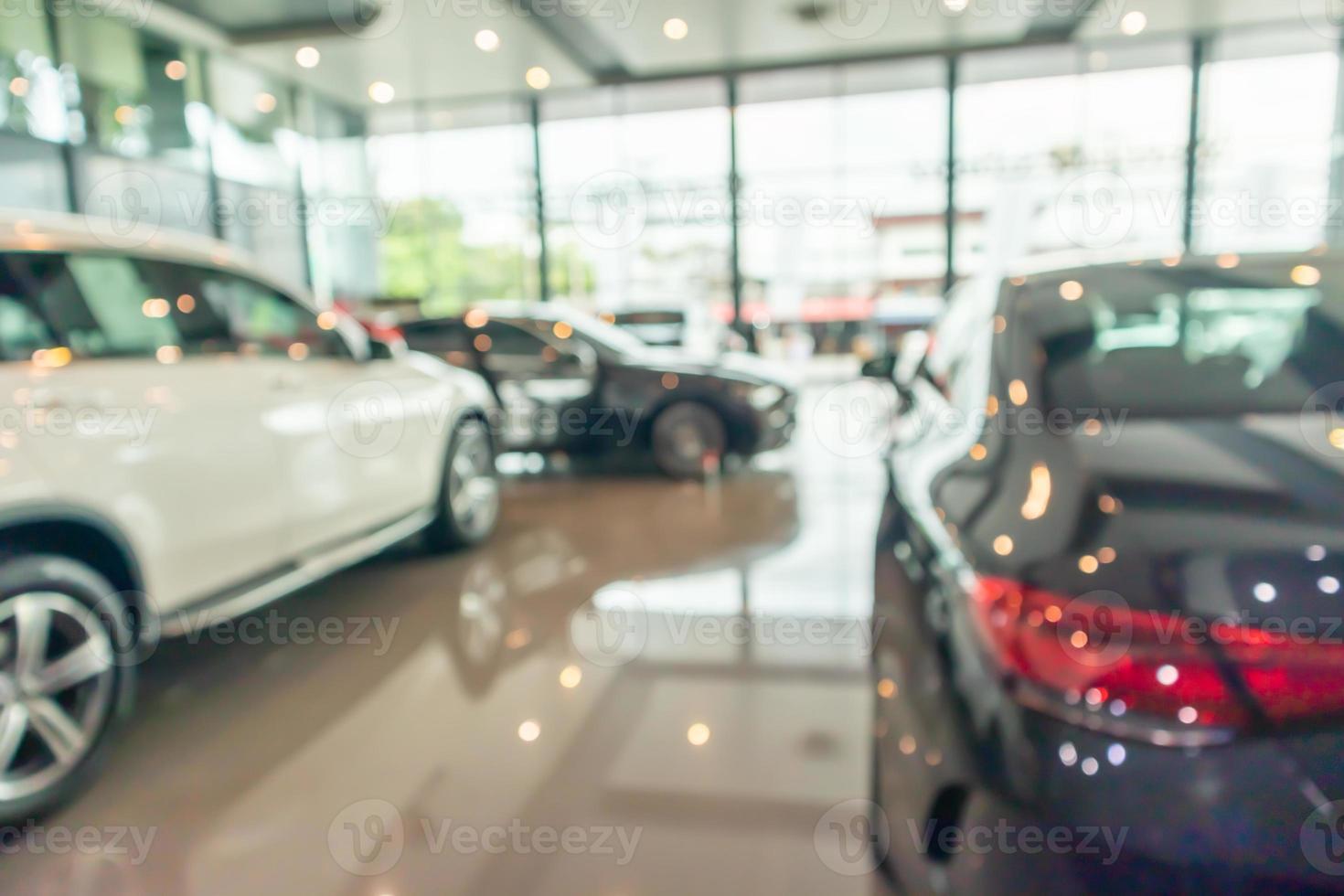 new cars in showroom interior blurred abstract background photo