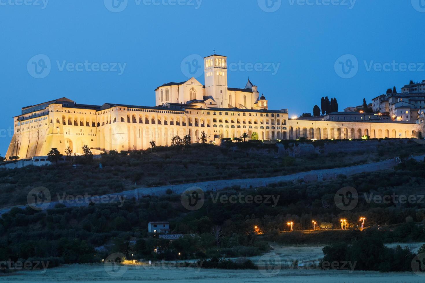 Assisi Basilica by night,  Umbria region, Italy. The town is famous for the most important Italian Basilica dedicated to St. Francis - San Francesco. photo