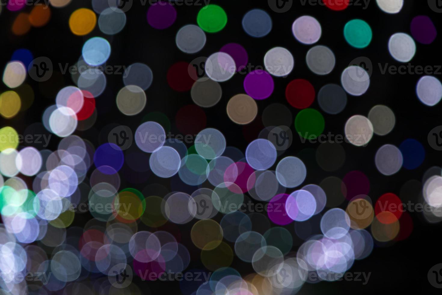 Colorful Defocus Abstract bokeh light effects on the night black background texture photo