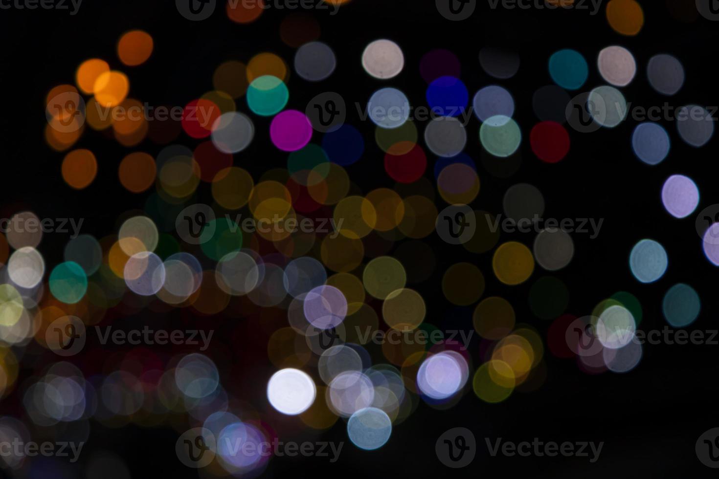 Colorful Defocus Abstract bokeh light effects on the night black background texture photo