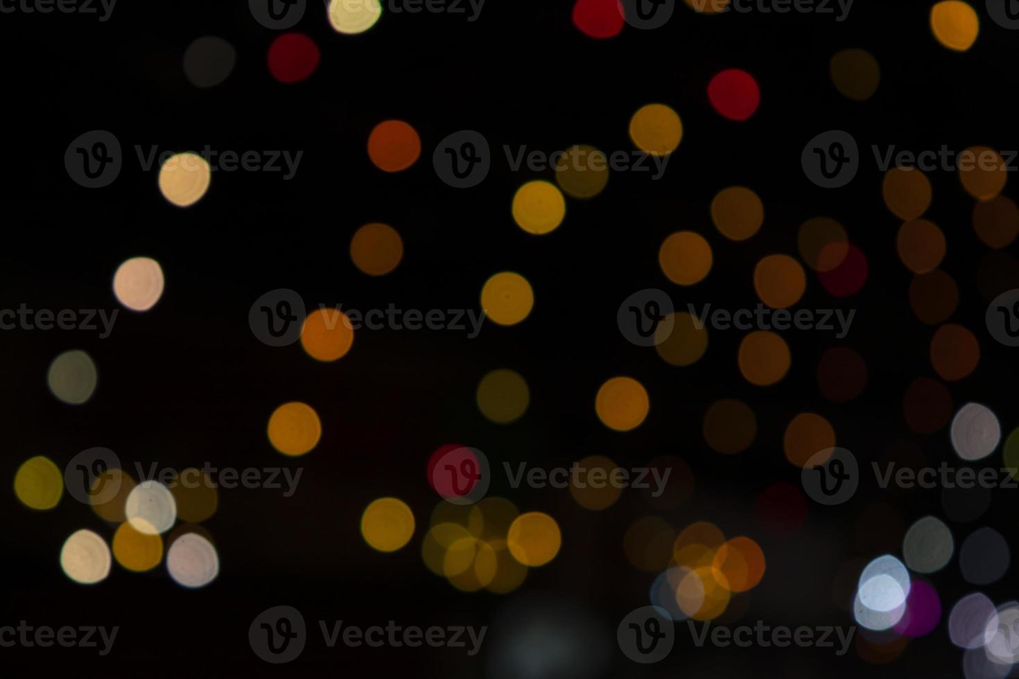 Colorful Defocus Abstract bokeh light effects on the night black background texture photo