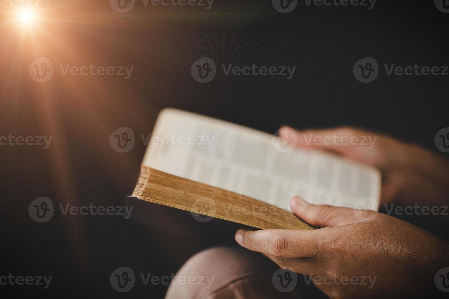 Young woman person hand holding holy bible with study at home. Adult female christian reading book in church. Girl learning religion spirituality with pray to god. concept of student education faith. photo