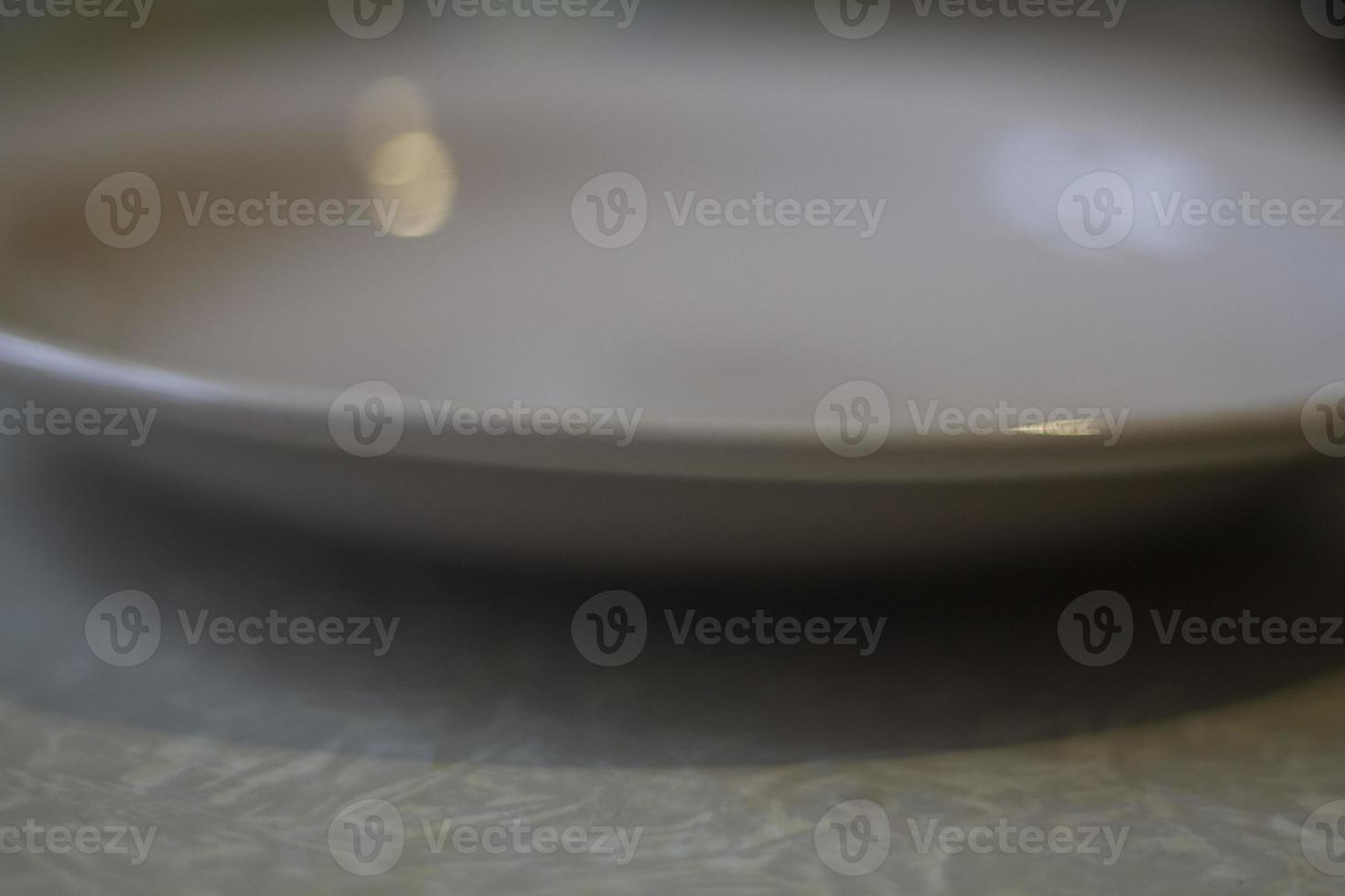 Plate on table. Empty plate in kitchen. Dishes for eating. photo