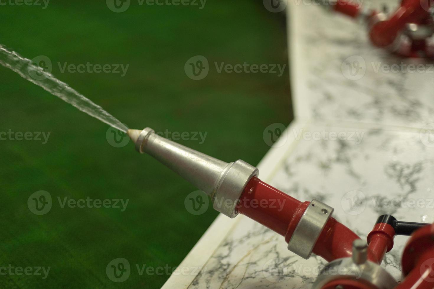 Fire faucet with water. Fire station parts. Means of protection against fire. photo
