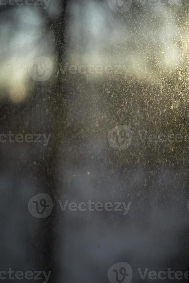 Cloudy glass. Dirt on window. Dust on window. photo