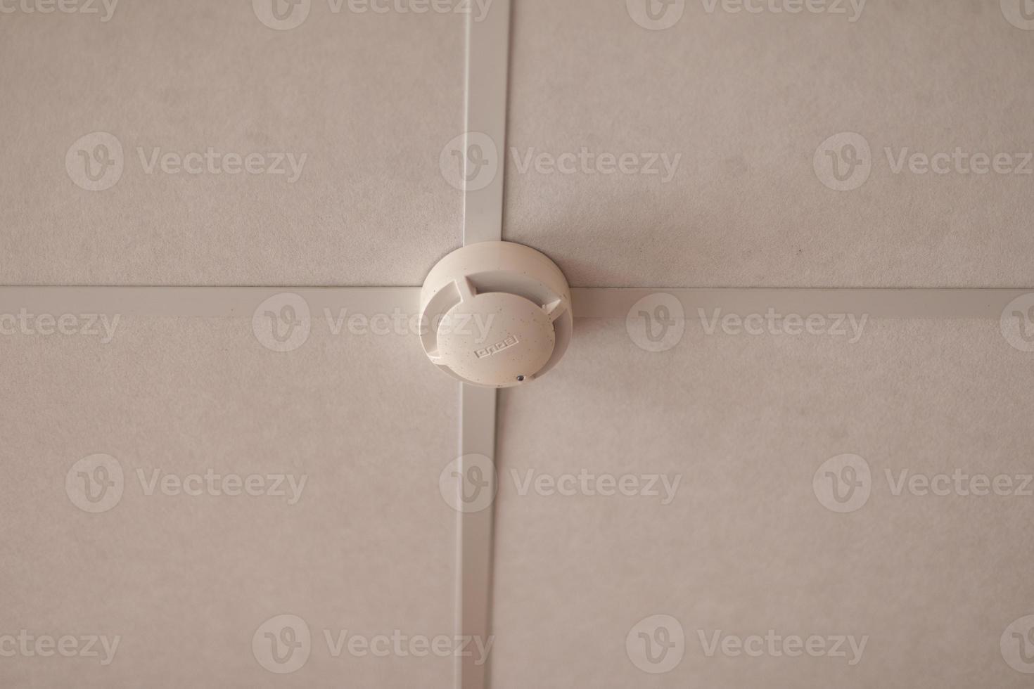 Fire protection system on ceiling. Smoke detector. photo