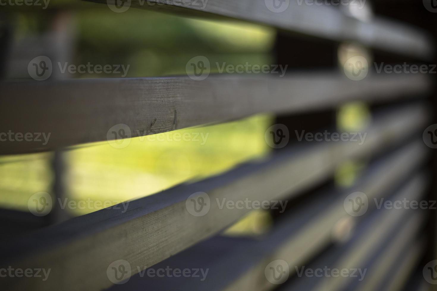 Wooden veranda. Fence in house. Details of architecture in countryside. photo