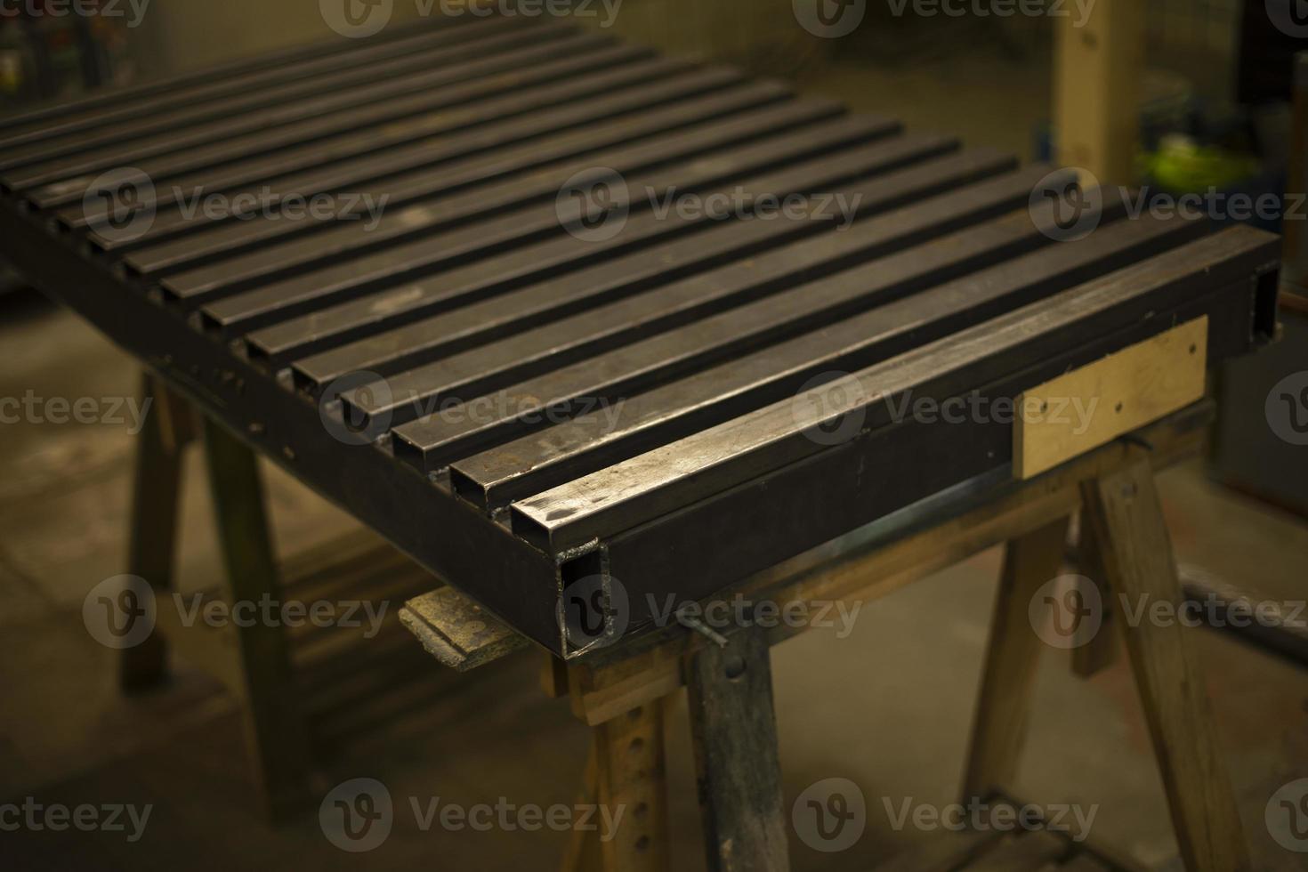 Steel table. Industrial processing. Details of work with structure. photo