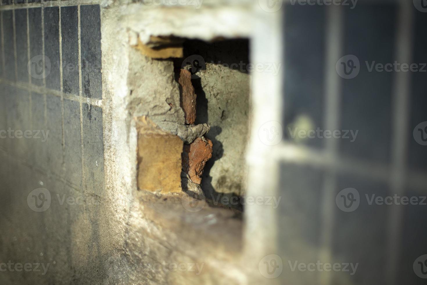 Hole in basement of house. Hole in wall. photo