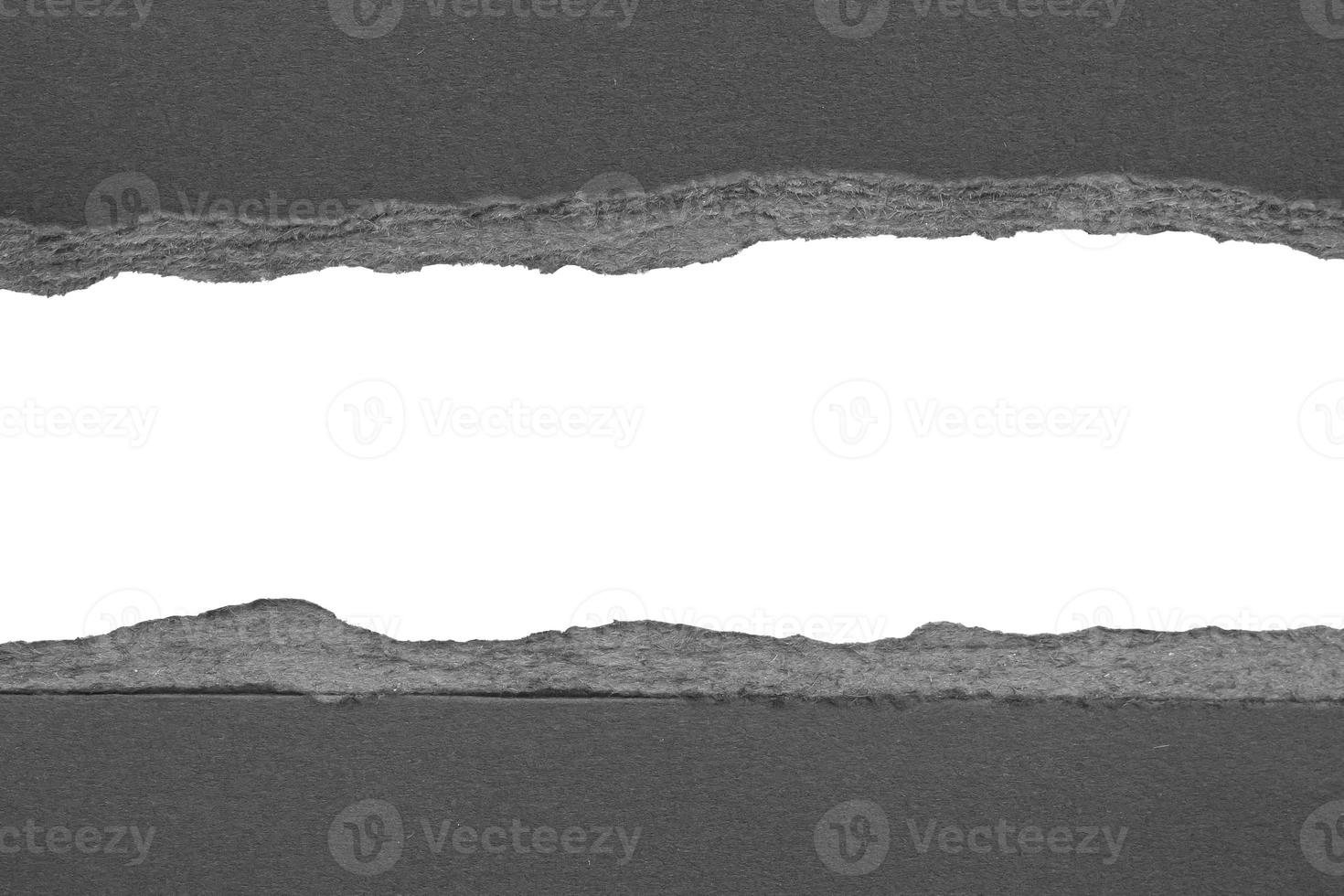 Black ripped paper torn edges strips isolated on white background photo