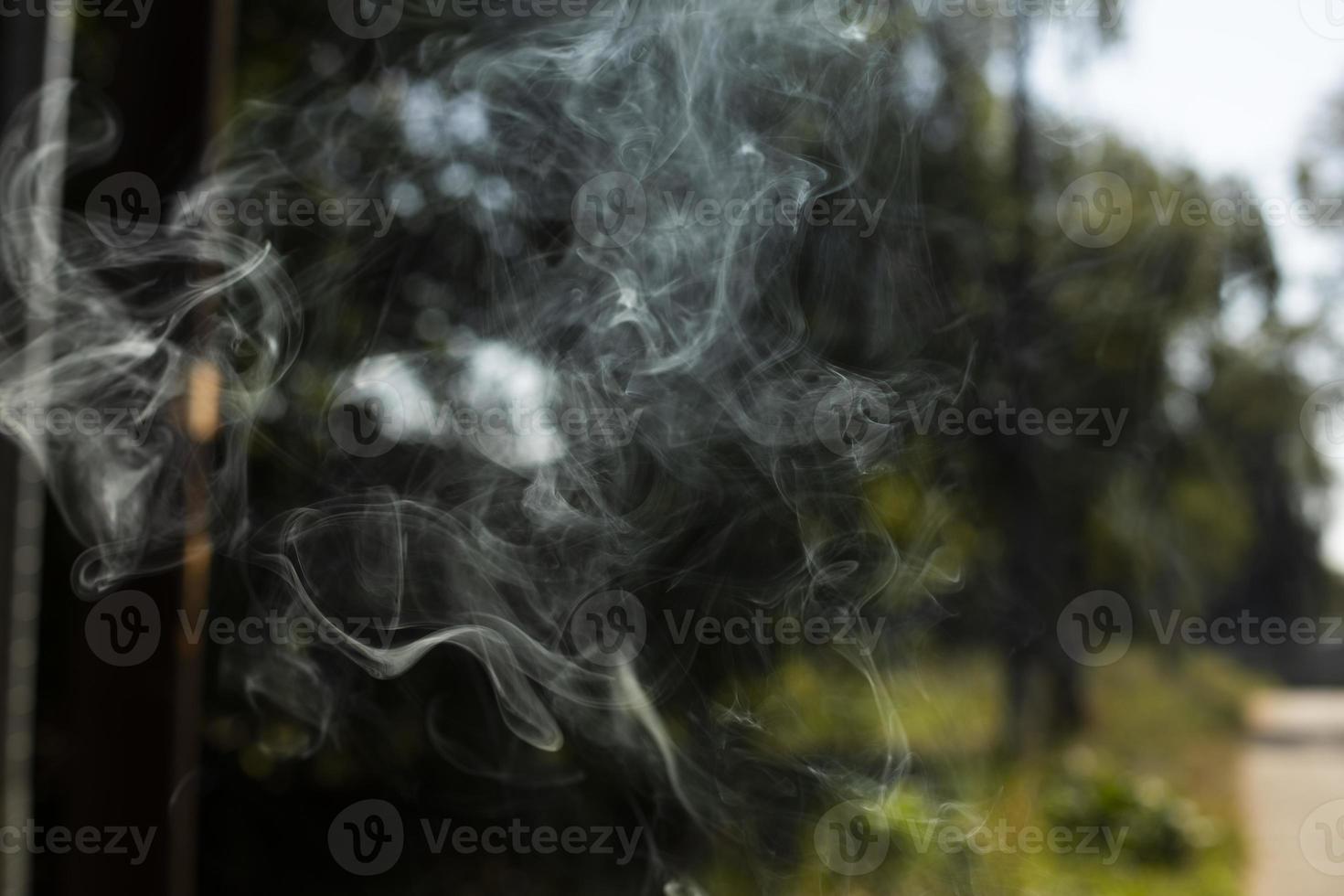 Smoke in air. Smoke flies. Simple background with hot air particles. photo