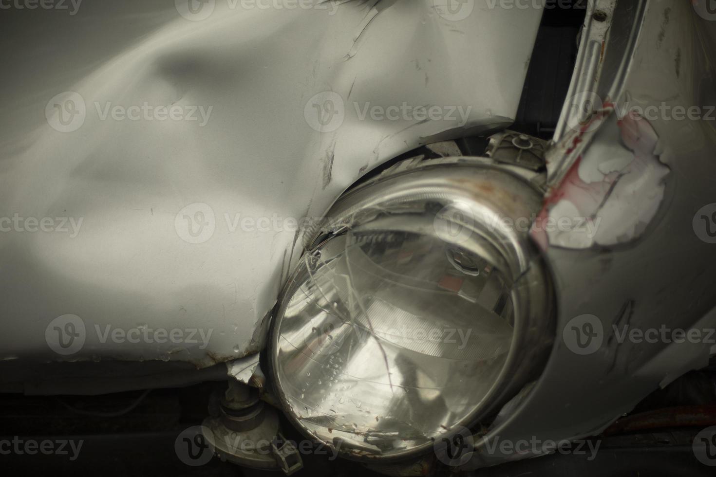 Broken headlight of car. Transport after accident. Broken metal. Machine is broken. photo