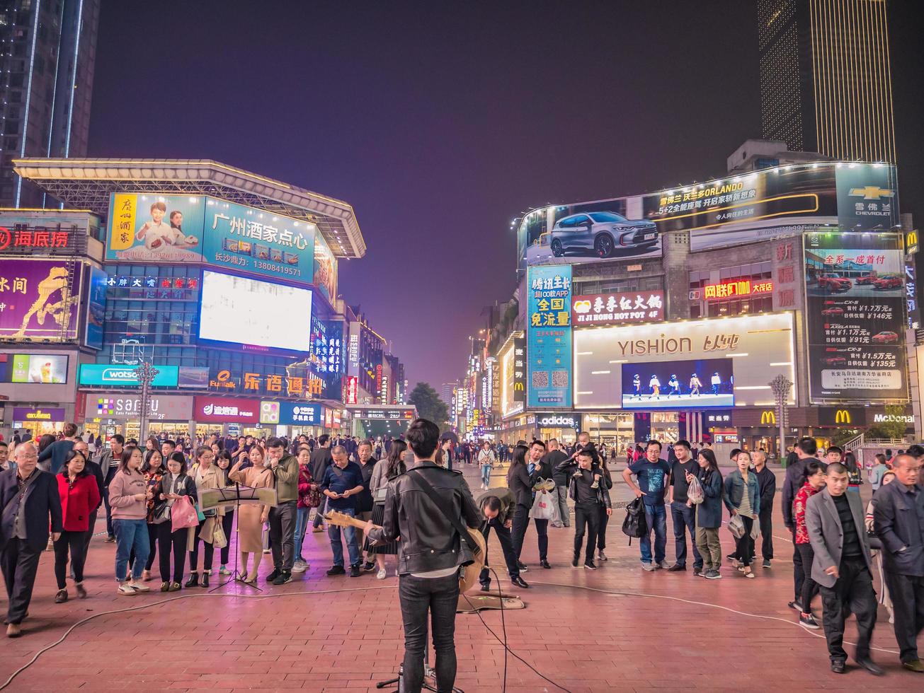 Changsha.China-17 October 2018.Unacquainted street performers singing at huangxing walking street in Changsha city China.changsha is the capital and most populous city of Hunan province in china photo