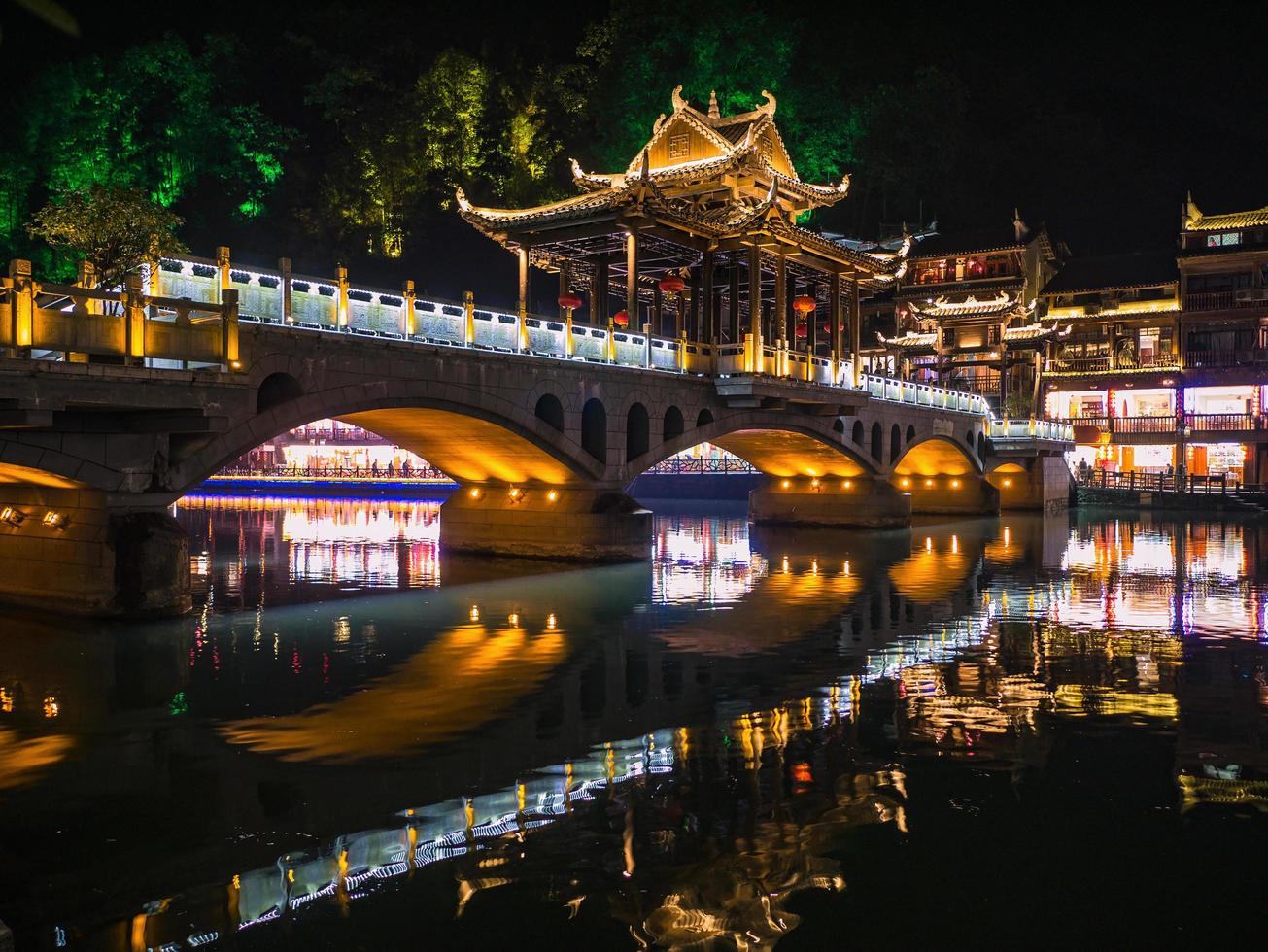 Scenery view of the bridge in the night of fenghuang old town .phoenix ancient town or Fenghuang County is a county of Hunan Province, China photo